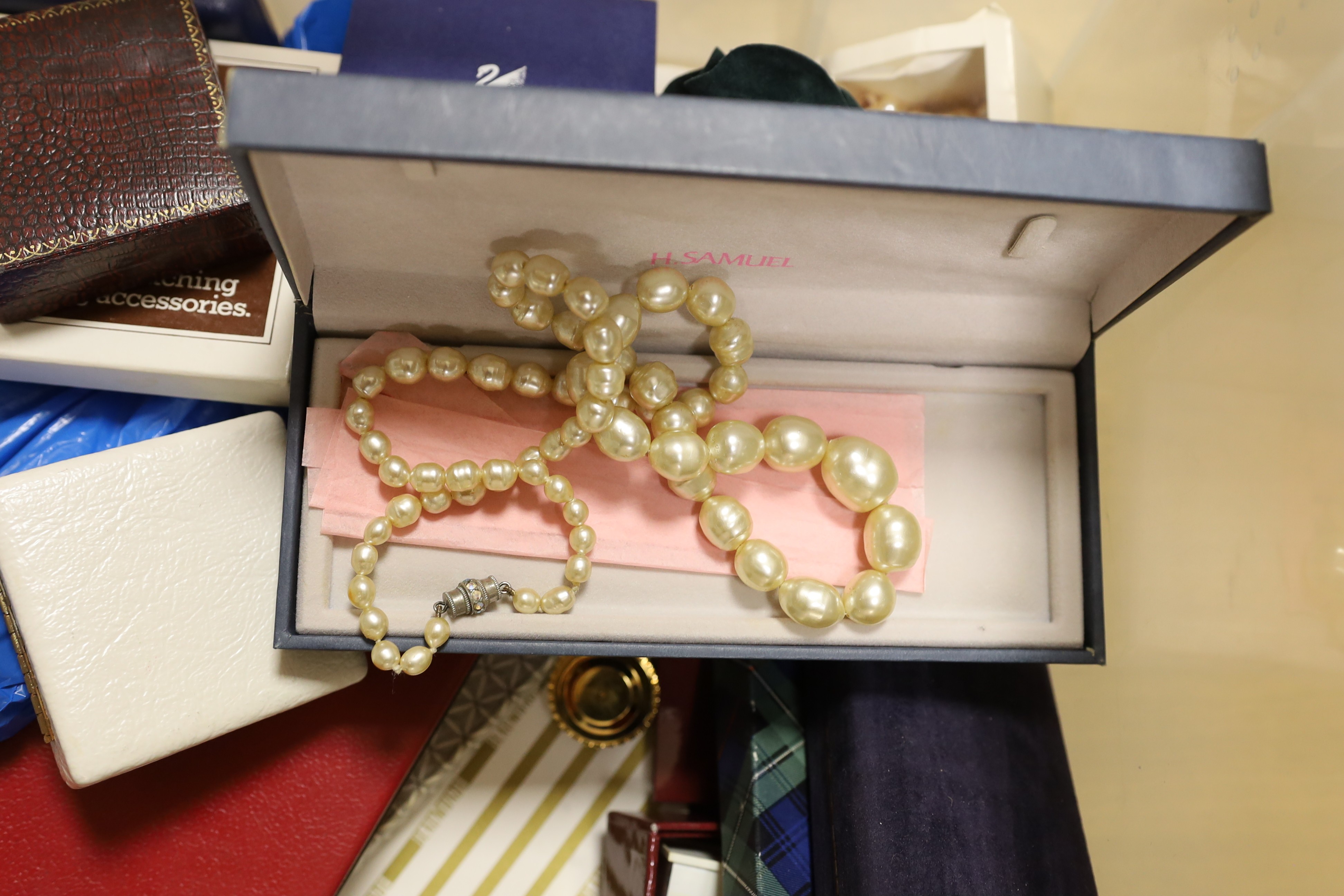 A large quantity of assorted costume jewellery. including white metal.